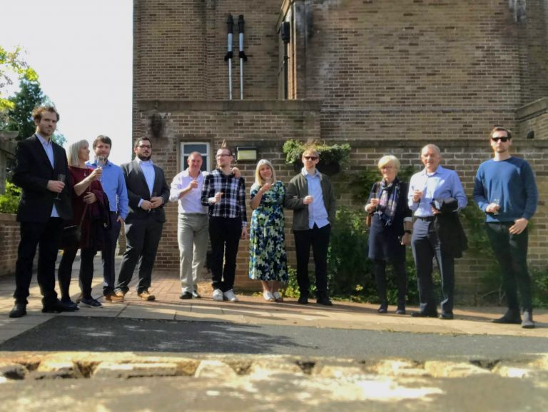 Raising a glass to Molly after the service.